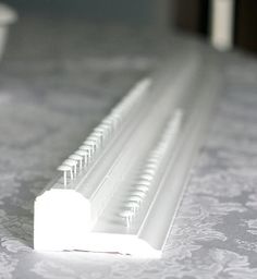 an image of a close up view of the edge of a window seal on a bed