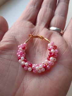 Gouden hoop earrings with 3 color pink small beads. I made the beads around the circle of the earring. The hoop earrings are of stainless steel, retain the color, and have a locked closure. The beads are 0,08 inches round long and the have the color, light pink, pink and dark pink. The earrings are of stainless steel and 1,18 inches round. These hoop earrings are light and comfortable to wear. These earrings are made with love. Beautiful summer earrings, the match any type of clothing. The jewel Pink Hoop Earrings With Tiny Beads For Gift, Pink Hoop Earrings With Tiny Beads As Gift, Pink Hoop Beaded Earrings, Pink Hoop Earrings With Colorful Beads, Adjustable Pink Hoop Earrings, Pink Hoop Beaded Earrings With Tiny Beads, Pink Tiny Beads Hoop Earrings, Pink Small Hoop Jewelry With Tiny Beads, Pink Small Hoop Beaded Earrings As Gift