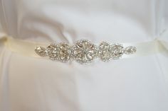 "Sophisticated and elegant bridal bridesmaid , very delicate dress sash belt.  This is unique luxury bridal belt with delicate rhinestone crystal applique. Fully encrusted with large crystals and rhinestones attached to double side satin ribbon. It will look great with any color dress, being either white, diamond, ivory, or antique.  Looks great in the front , or on the side ! Made of  - lovely stunning design applique decorated with tiny silver glass beads and crystal rhinestones in different s Dress Sash Belt, Rhinestone Wedding Dress, Delicate Dress, Bridesmaid Belt, Belt Luxury, Bridal Sash Belt, Wedding Dress Sash, Wedding Sash Belt, Dress Sash