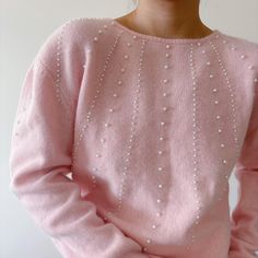 Vintage pullover sweater. Cutest pink color. Beaded with faux pearls. It seems to have wide shoulders, maybe that's where the shoulder pads were.  Excellent vintage condition Material: 70% lambs wool, 20% angora, 10% nylon.   label size M. Model is 5'5'', 128 lbs, usually US size 5 Flat measurements: bust: 20'' (40'' around) Across the shoulders: 19'' length: 24'' Follow us on Instagram (oldgemvintage) for more choices! Please ask me about international combined shipping.  Please check the flat measurements before purchase since all sales are FINAL. Except it is mistake on my part, in which case I will refund the purchase. I do my best to examine the garments but make mistakes sometimes, please let me know if that is the case. Thank you so much!  Please note that these are vintage clothing Pull Angora, Wide Shoulders, Pull Rose, Vintage Pullover, Angora Sweater, Vintage Pullovers, Minimalist Capsule Wardrobe, Angora Rabbit, Rose Blush