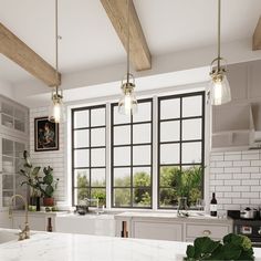 a large kitchen with marble counter tops and white walls, along with wooden beams on the ceiling