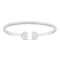 This charming bangle bracelet for her adds a touch of sparkle to her wrist and can be layered with other bracelets or worn alone. The sterling silver bangle features a heart-shaped design at each end, each shimmering in 1/10ctw. Heart Bangle Bracelet, Bracelet For Her, Sweet 16 Gifts, Sterling Silver Bangle, Kay Jewelers, Bracelet Sterling Silver, Sterling Silver Bangles, Silver Bangle, Silver Bangles