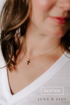 Our mini cross pendant is a dainty statement to add sparkle to any look. Details: - 18k gold-filled mini cross pendant - Your choice of chain length (16", 18", or 20") - All materials are lead & nickel free - Handmade with love by Luna & Jade in the U.S. 14k Gold Cross Necklace With Adjustable Chain, Dainty 14k Gold Cross Necklace, Dainty 14k Gold Cross Necklace With Delicate Chain, Dainty Yellow Gold Cross Necklace With Adjustable Chain, Yellow Gold Charm Necklace With Cross Pendant, Everyday 14k Gold Filled Cross Pendant Necklace, Yellow Gold Cross Pendant Charm Necklace With Delicate Chain, 14k Gold Filled Cross Pendant Jewelry With Adjustable Chain, Dainty Yellow Gold Cross Necklace For Everyday