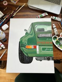 a drawing of a green car is on the table