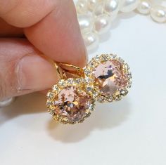 Ideal bridal or bridesmaids earrings! Pink Gold Cubic Zirconia Earrings For Weddings, Glamorous Pink Bridal Earrings For Wedding, Elegant Round Pink Bridal Earrings, Elegant Peach Jewelry For Formal Occasions, Pink Earrings For Bridesmaids, Pink Sparkling Crystal Earrings For Wedding, Glamorous Pink Bridal Earrings, Elegant Formal Peach Jewelry, Elegant Peach Formal Jewelry