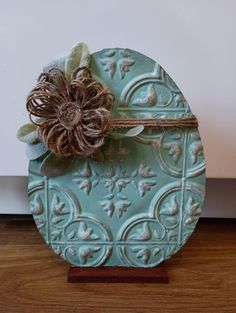 a decorative piece with a flower on it