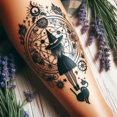 a woman's leg with a tattoo on it and an image of a witch