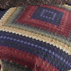 a quilted bedspread with an intricate design