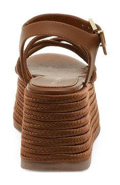 Espadrille-inspired braiding highlights the lofty platform sole of this bold, retro sandal. 3 1/4" heel; 2 3/4" platform Textile and leather upper/synthetic lining/rubber sole Imported Leather Platform Wedge Sandals For Vacation, Leather Chunky Platform Sandals For Beach, Leather Wedge Sandals With Braided Straps For Beach, Leather Wedge Sandals With Braided Straps For Vacation, Brown Open Toe Wedge Sandals With Woven Leather, Leather Wedge Sandals With Woven Detail And Ankle Strap, Leather Wedge Sandals With Woven Leather Ankle Strap, Casual Leather Wedge Sandals With Braided Straps, Brown Wedge Sandals With Ankle Strap And Woven Sole