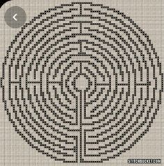 a black and white cross stitched maze with an arrow in the center on top