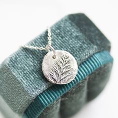 Charm necklace with fern leaf texture. I sculpted it from silver metal clay and then fired it to become fine silver. The pendant is about 14mm (1/2") in diameter. You can buy it with or without a dainty sterling silver chain. If you are buying it as a gift I would suggest a 16" (40cm) or 18" (45cm) chain. If you are unsure about the length, place a string around your neck and hold both ends by your chest where you want the pendant to sit, then measure the length of the string. You will receive i Grass Texture, Silver Metal Clay, Fern Leaf, Winter Jewelry, Leaf Texture, Inspired Necklace, Jewelry Workshop, Jewelry Making Project, Hair Clothes