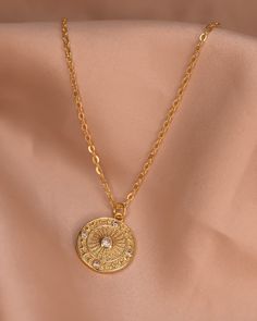 The Sianna necklace is a stunning circle shaped necklace that shines brightly with any outfit. The simplistic beauty of the pendant on the bold chain makes it the perfect piece to wear from work to a night out, or layered with other Stavi Sol necklaces! Chain 24K Gold Filled Rolo Chain Length: 20” inches Charms: 24K Gold Filled 15mm x 15mm Gold Circular Charm Necklace With Adjustable Chain, Gold Plated Circle Necklace With Adjustable Chain, Gold Round Chain Charm Necklaces, Delicate Chain Gold-plated Necklace, Gold Coin Necklace With Adjustable Chain And Round Pendant, Gold Full Circle Necklaces With Adjustable Chain, Gold Plated Coin Necklace With Adjustable Chain, Gold Round Charm Necklace With Chain, Gold-plated Delicate Chain Necklace