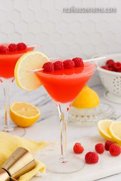 two glasses filled with raspberry lemonade martinis