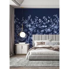 a bedroom with blue wallpaper and white furniture