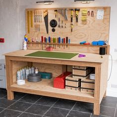 a workbench with lots of tools on it