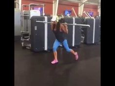 a woman is dancing in the gym