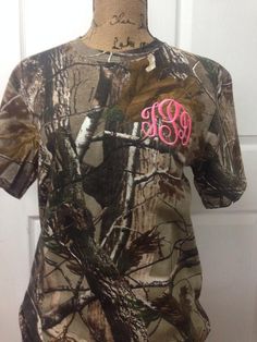 Monogrammed Unisex Camo Short Sleeved T-ShirtLet you southern charm out with this cute camo t-shirt!-5.4-ounce, 100% cotton jersey-Russell Outdoors Realtree CamoWe can also do Greek letters. Just include the letters at checkoutINFORMATION NEEDED: REVIEW OPTIONS IN PICTURES. (enter in notes to seller at checkout). 1. Font Number2. Thread Color 3. Initials (Enter in how you want it to appear on the shirt. E.g. Cindy Shay Hudson. cHs) ***PLEASE PUT ALL INFORMATION IN NOTES TO SELLER AT CHECKOUT IF Camouflage Cotton T-shirt With Sublimation Print, Camouflage Cotton Top With Sublimation Print, Camouflage Cotton T-shirt With Letter Print, Camouflage Sublimation Print Crew Neck T-shirt, Camouflage Crew Neck T-shirt With Sublimation Print, Camouflage Cotton Short Sleeve T-shirt, Camouflage Short Sleeve Top With Letter Print, Camouflage Short Sleeve Tops With Sublimation Print, Camouflage Cotton Top With Letter Print