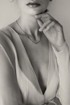 black and white photograph of a woman wearing a necklace