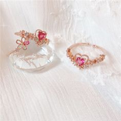 This is our most loved ring out of the entire ring collection. Treat yourself or spoil your girlfriend with our bestselling Layla ring <3 📌 Please Note: When adjusting the ring, please squeeze or expand the ring body slowly and gently. 💎 Materials: 14k Gold Electroplated - more durable than regular platings Cubic Zirconia Pink Heart Ring, Pink Heart Rings, Glassine Bags, Reward Yourself, Fancy Jewelry, Green Item, Ring Collections, Jewelry Pouch, Jewelry Gift Box