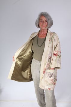 Japanese Kimono style loose fitting jacket in Sanderson's linen floral print Green satin lining Pockets fully lined Stone linen front and sleeve bands Loose fitting One off Back length 81 cm Sizes 12 - 16 All my jackets and coats are unique one offs. I am drawn to collecting various fabrics in small quantities. The colours or prints will speak to me as here in the very English Country Garden Sanderson linen. The soft green satin lining reflecting the greens of the garden. My jackets are inspired Spring Cream Outerwear With Floral Print, Cream Floral Print Outerwear For Spring, Spring Floral Print Outerwear For Daywear, Bohemian Beige Floral Print Outerwear, Spring Floral Print Outerwear With Kimono Sleeves, Spring Outerwear With Relaxed Fit And Kimono Sleeves, Spring Outerwear With Kimono Sleeves And Pockets, Spring Kimono With Pockets, Cream Kimono For Daywear In Spring