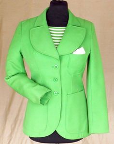 "Green wool/polyester jacket 1970, how stylish is this??!! Cool shade of lime Green that appears to have had fairly little wear but was never cleaned. Very continental styling as was common in all of Western Europe (where it was made) at this point. Love the rounded nature of the collar and patch pockets. Stated 38 I would put this as an 8-10 UK: 18\" p-p/ 15\" shoulder/ 15.5\" across waist/ 19\" across hips/ 23\" sleeve/ 26\" length. 50£ NB The outer garment is perfect, the inner shows dirt on the collar and lining. I can have this dry cleaned if asked before purchase or will leave it to you." Casual Green Wool Blazer, Fitted Green Outerwear With Pockets, Spring Green Blazer For Tailoring, Green Wool Single Breasted Blazer, Fitted Green Cotton Outerwear, Green Wool Single-breasted Blazer, Fitted Green Cotton Blazer, Retro Green Blazer For Workwear, Retro Green Blazer For Work