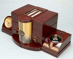 an old fashioned radio sitting on top of a wooden stand