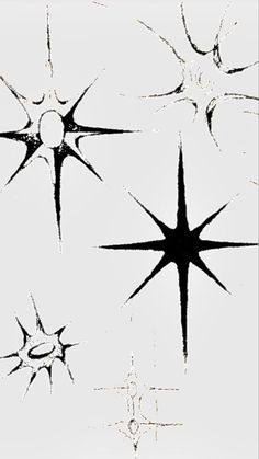 four black and white stars on a white background