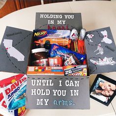 an open box filled with candy on top of a table