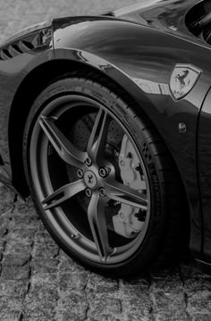 a black and white photo of a sports car