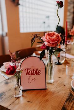 Trafalgar Warehouse Disco Wedding with all pink wedding table decorations with pink arched table number sign and pink flowers in glass vases Glass Vases Wedding, Wedding Table Number Signs, Wedding Table Names, Pink Wedding Theme, Wedding Vases