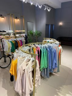 clothes are on racks in a clothing store