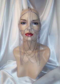 "This silver face chain mask is styled after the character Lady Jessica of the sci fi series Dune. Constructed entirely of silver chain, it lays comfortably on the head and face. The multi layers of chain links allow for graceful movement in its lower front section. It attaches securely in the back with a lobster claw latch for size adjustment. This piece will fit a 20\"- 24 1/2\" head size and can be adjusted in the back for a good fit Lower section of chain links drop to 9\" All items are made Chain Mail Head Piece, Chain Mask Face, Face Chains, Chain Face Veil, Cleopatra Headpiece, Gold Chain Headpiece, Chainmail Headdress, Lady Jessica, Chain Headdress