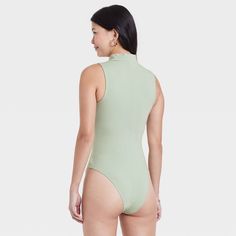 Refresh your separates closet as the seasons change with the Mock Turtleneck Tank Bodysuit from A New Day™. This sleeveless pull-on tank bodysuit is designed in elegant solid hues for a sophisticated look, and it features a mock turtleneck neckline for additional flair. The bodysuit is made from a soft and stretchy cotton-blend fabric to give you a comfortable fit that moves with you, and it boasts a full-coverage bottom with metal snaps at the crotch for added convenience and confident wear. We Mock Neck Bodysuit, Seasons Change, Tank Bodysuit, Short Torso, Long Torso, Versatile Outfits, Mock Turtleneck, Changing Seasons, Staple Pieces