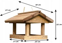 a wooden bird feeder with measurements for it