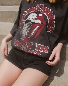 Officially Licensed for The Rolling Stones via Bravado Oversized Fit One Size Fits Most 100% Cotton Officially Licensed via the CLC Oversized Edgy T-shirt For Fall, Oversized Long Sleeve T-shirt For Concert, Black Long Sleeve Rock Tops, Relaxed Fit Black Top For Concert, Oversized Black Band Merch Top, Oversized Letter Print Top For Concert, Oversized Letter Print Tops For Concerts, Trendy Oversized Tops For Concerts, Rock Style Graphic Print Tops For Fall