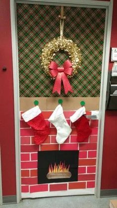 a christmas fireplace decorated with stockings and stockings