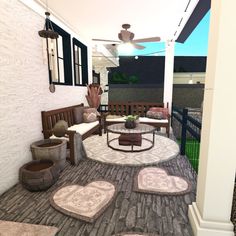 a porch with furniture and rugs on the floor