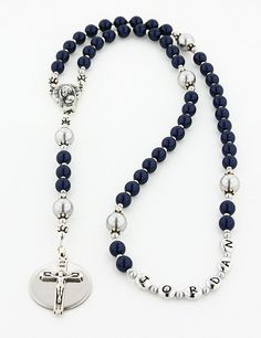 "This Baptism Boy Rosary makes a one of a kind baptism or christening gift. The dark blue & gray pearls combine to create a simply masculine and charming rosary. It is available with or without a Name in the 3rd decade and with or without an Engraved Disc. The rosary is made with all Genuine Swarovski Pearls and it comes with your choice of a gift message that is elegantly boxed for simple gift giving. Add a Name in Beads - Select a name option. - Enter a name that is 10 characters or less. Blue Spiritual Jewelry For First Communion, Personalized Adjustable Rosary With Round Beads, Blue Beaded Rosary As A Gift, Blue Cross Rosary For Gift, Adjustable Blue Rosary With 8mm Beads, Blue Rosary With Round Beads For Gift, Blue Rosary With 8mm Beads In Cross Shape, Adjustable Blue Rosary With Miraculous Medal, Hand-strung Round Beads Rosary As A Gift