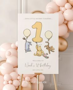 a birthday card with winnie the pooh and tiggers on it next to balloons