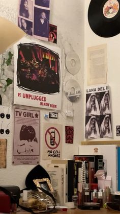 a room with various records and posters on the wall