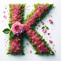 the letter k is made up of pink roses and green leaves with petals scattered around it