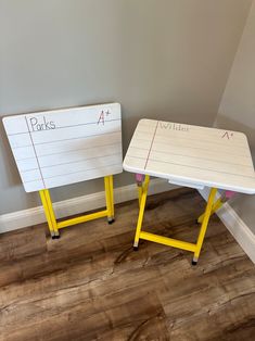 two yellow and white tables with writing on them