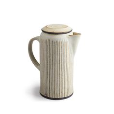 a white ceramic tea pot with a black stripe on the bottom and a wooden lid