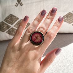 This ring is handcrafted with care, ensuring that the real pressed flowers are arranged in a stunning and unique design. Each ring has its own elaborate combination of flowers, making it a one-of-a-kind piece of art.  This Flower Ring is a beautiful reminder to embrace and appreciate the beauty that surrounds us. This botanical resin ring is perfect for any occasion- whether you are celebrating a special milestone or just want to treat yourself to a breathtaking work of art.  Our ring is designed to comfortably fit any finger size, allowing you to bring a touch of nature's magic with you wherever you go. Its lightweight and delicate construction add to its effortless charm, making it perfect for daily wear or special occasions.  This Real Flower Ring is the perfect way to show your appreci Nature-inspired Rose Gold Flower Ring As Gift, Bohemian Rose Gold Rings For Gift, Bohemian Rose Gold Rings As Gift, Round Floral Print Jewelry Gift, Round Floral Print Jewelry For Gift, Floral Print Round Jewelry Gift, Floral Print Round Jewelry For Gifts, Flower-shaped Birth Flower Rings For Gift, Flower Shaped Ring With Pressed Flowers For Gift