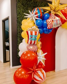 balloons and streamers in the shape of stars are on display