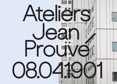 an advertisement for ateliers jean prouve in front of a white building with black lettering