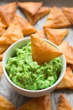 a bowl filled with guacamole and chips