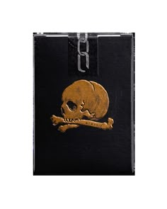 a black wallet with a gold skull and crossbones on the front, hanging from it's side