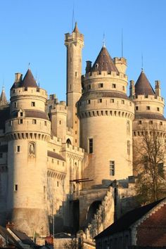 an old castle with towers and turrets is shown