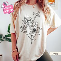 Flower Corsage Shirt, Boho Style Shirt, Botanical Shirt, Wildflower Tees, Comfort Color Floral Nature Tee, Plant Lover Shirt, Gift for Mama Our high-quality shirts come in a variety of sizes and colors to suit your needs. If you have any questions or special requests, please don't hesitate to contact us. We hope you enjoy browsing our shop and find something you love! FEATURES COMFORT COLORS: * Sizes Offered: Refer to the drop-down menu for available sizes. * Colors: See the drop-down menu and p Nature Tees, Botanical Shirt, Flower Corsage, Boho Shirts, Comfort Color, Style Shirt, Plant Lover, Unisex Shirts, Combed Cotton